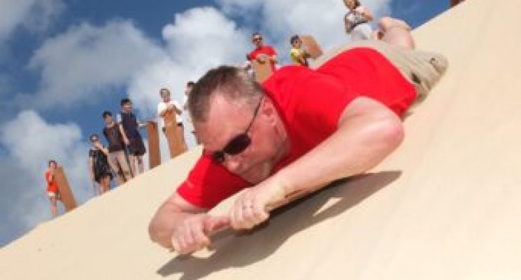 A-sledding-the-sand-dune-340x255